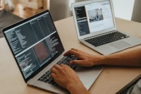 Developer coding app on laptop